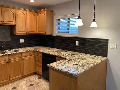 Apartment 18 kitchen countertop and dishwasher