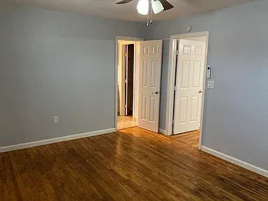 Apartment 18 bedroom looking toward the bathroom and closet